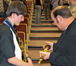 Bob Draga gives clarinet advice to a promising jazz student