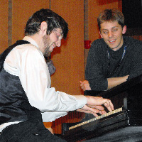 Jason Wanner watches a piano student
